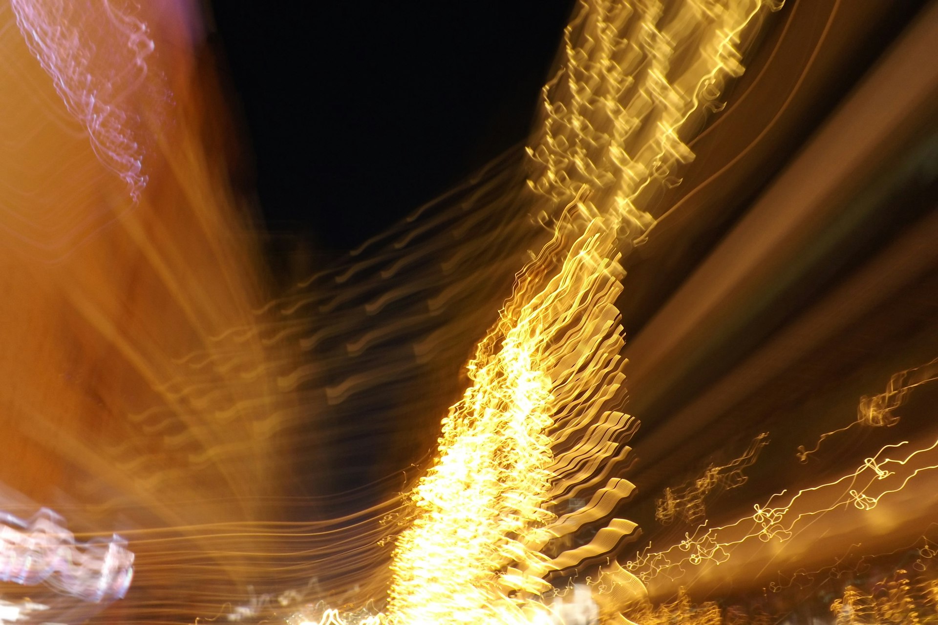 A blurry photo of a street at night